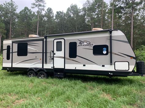 Has bunks towards the rear of camper Outdoor kitchen Outdoor shower Has receiver hitch to pull a trailer behind No damage to the. . Pull campers for sale near me